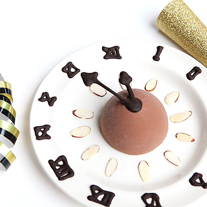 New Year Clock Dessert with edible clock hands